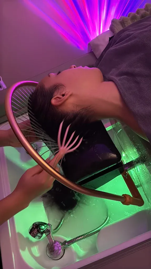 Hydrotherapy arch glowing over a head spa basin at Soul Massage Lynnwood, the studio nearest Shoreline WA