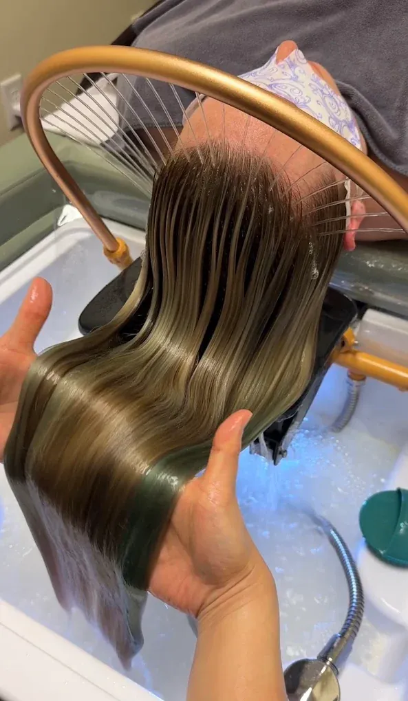 Hair finished with Moroccan oil after the blow-dry that ends every session