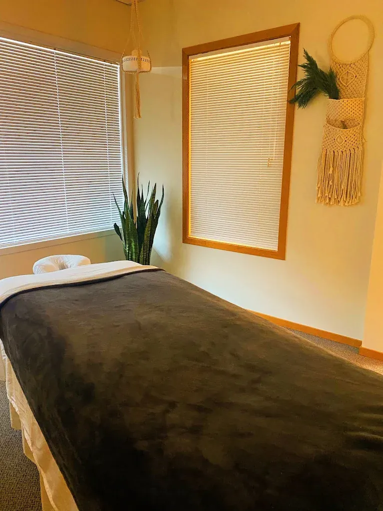Therapist working slow deep tissue massage strokes at Soul Massage Head Spa Everett